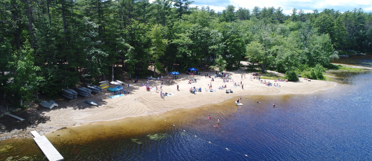 The beach and lake at Papoose Pond Family Campground