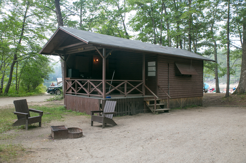 Comfortable Family Cabins located near public bathhouses include dining porch and 4-6 beds