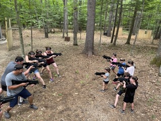 Families playing laser tag at Papoose Pond Campground